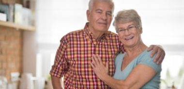 Portrait of joyful senior couple in the kitchen